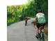 Paved community trail beside a lake, great for biking at 6640 Stratford Pl, Cumming, GA 30040