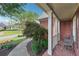 Inviting front porch with brick flooring and elegant columns, perfect for relaxation at 6640 Stratford Pl, Cumming, GA 30040