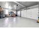 Spacious garage with ample storage space, and extra room, offering functional utility for homeowners at 6640 Stratford Pl, Cumming, GA 30040