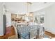 Eat-in kitchen featuring stone accents, stainless appliances and views to backyard at 6640 Stratford Pl, Cumming, GA 30040