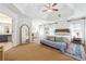 Bright and airy main bedroom with trey ceiling, many windows, and stylish decor at 6640 Stratford Pl, Cumming, GA 30040