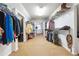 Large walk-in closet with ample storage and organization options at 6640 Stratford Pl, Cumming, GA 30040