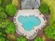 An aerial shot of the community pool surrounded by lush landscaping and lounge chairs for residents at 912 Santa Anita Dr, Woodstock, GA 30189