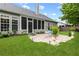 Charming backyard showcasing a stone patio and screened in porch, offering a cozy outdoor living space at 912 Santa Anita Dr, Woodstock, GA 30189