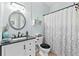 Cozy bathroom with light blue walls, modern fixtures, and stylish decor at 912 Santa Anita Dr, Woodstock, GA 30189