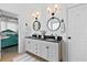 Charming bathroom with double vanity, black hardware, and shiplap accent wall at 912 Santa Anita Dr, Woodstock, GA 30189
