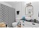 Stylish bathroom with patterned shower curtain, black countertops, and a vessel sink at 912 Santa Anita Dr, Woodstock, GA 30189