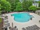 Large community pool with plenty of lounge chairs and tables for residents at 912 Santa Anita Dr, Woodstock, GA 30189