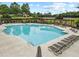 Large community pool featuring ample seating, pergola, and umbrellas for residents' enjoyment at 912 Santa Anita Dr, Woodstock, GA 30189