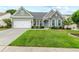 Charming single-story home with a well-manicured lawn, stone accents, and a welcoming front porch at 912 Santa Anita Dr, Woodstock, GA 30189
