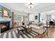 Comfortable living room featuring a fireplace, large windows, and neutral decor at 912 Santa Anita Dr, Woodstock, GA 30189
