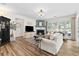 Cozy living room featuring a fireplace, large windows, and comfortable seating at 912 Santa Anita Dr, Woodstock, GA 30189