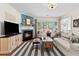 Inviting living room with fireplace, large windows, and stylish furnishings at 912 Santa Anita Dr, Woodstock, GA 30189