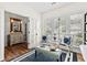 Bright office space with French doors, built-in bookshelves, and large windows at 912 Santa Anita Dr, Woodstock, GA 30189