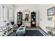 Stylishly decorated sitting room with a decorative mirror, ample natural light, and elegant furnishings at 912 Santa Anita Dr, Woodstock, GA 30189