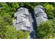 Aerial perspective showcases townhome roofs nestled amidst verdant trees, highlighting community layout at 3102 Balearic Se Dr, Marietta, GA 30067