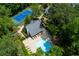Aerial view showcasing community amenities including tennis court and swimming pool at 3102 Balearic Se Dr, Marietta, GA 30067