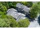 Aerial view of the multi-story condo with trees and street parking at 3102 Balearic Se Dr, Marietta, GA 30067