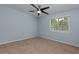 Light-filled bedroom with neutral carpet, large window, and soft blue walls at 3102 Balearic Se Dr, Marietta, GA 30067