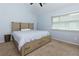 Inviting bedroom with a bed featuring built-in drawers, carpet, and natural lighting at 3102 Balearic Se Dr, Marietta, GA 30067