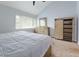Serene bedroom with light-colored furniture, neutral carpet, and ample storage at 3102 Balearic Se Dr, Marietta, GA 30067