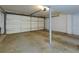 Spacious garage with a roll-up door and painted walls, offering plenty of parking space at 3102 Balearic Se Dr, Marietta, GA 30067