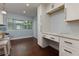Bright kitchen/office space with white cabinetry, ample counter space, and modern appliances at 3102 Balearic Se Dr, Marietta, GA 30067
