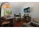 Cozy living room with plush seating, mounted TV, and an abundance of natural light at 3102 Balearic Se Dr, Marietta, GA 30067