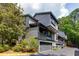 A spacious townhome with drive-under garages and multiple balconies overlooking a wooded area at 3102 Balearic Se Dr, Marietta, GA 30067