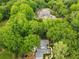 Aerial image of the home surrounded by mature trees and proximity to the Chattahoochee River at 4643 River Ct, Peachtree Corners, GA 30097