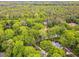 Aerial view showcases a heavily wooded area near Medlock Bridge Chattahoochee River National Recreation Area at 4643 River Ct, Peachtree Corners, GA 30097