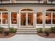 Elegant entry featuring arched windows and glass doors, creating a bright and welcoming ambiance at 4643 River Ct, Peachtree Corners, GA 30097