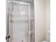Tiled shower with glass door and modern fixtures, providing a spa-like bathroom experience at 4643 River Ct, Peachtree Corners, GA 30097