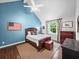 Cozy bedroom with vaulted ceiling, hardwood floors, and window with view at 4643 River Ct, Peachtree Corners, GA 30097