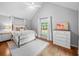 Bright bedroom with vaulted ceilings, neutral decor, and hardwood floors at 4643 River Ct, Peachtree Corners, GA 30097