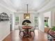 Breakfast nook with a white brick fireplace and wood flooring at 4643 River Ct, Peachtree Corners, GA 30097