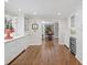 Butler's pantry with white cabinets, marble countertops, and stainless steel wine fridge at 4643 River Ct, Peachtree Corners, GA 30097