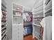 A well-organized walk-in closet with custom shelving and storage for clothes, shoes, and accessories at 4643 River Ct, Peachtree Corners, GA 30097