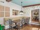 Cozy dining area featuring stylish decor, hardwood floors, and a large wooden table at 4643 River Ct, Peachtree Corners, GA 30097