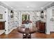 Charming entryway showcasing floral wallpaper, hardwood floors, and classic design elements at 4643 River Ct, Peachtree Corners, GA 30097
