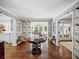 Elegant entryway featuring floral wallpaper, hardwood floors, and stylish decor throughout at 4643 River Ct, Peachtree Corners, GA 30097