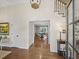 Spacious foyer with hardwood floors, staircase, elegant lighting, and views into other rooms at 4643 River Ct, Peachtree Corners, GA 30097