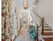 Inviting hallway featuring hardwood floors, staircase, natural light and elegant decor at 4643 River Ct, Peachtree Corners, GA 30097
