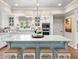 Bright kitchen with a large island, seating, marble countertops, and modern appliances at 4643 River Ct, Peachtree Corners, GA 30097