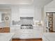 Modern kitchen with stainless steel gas range, subway tile backsplash, and white cabinets at 4643 River Ct, Peachtree Corners, GA 30097