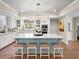 Bright kitchen with a large island, seating, marble countertops, and modern appliances at 4643 River Ct, Peachtree Corners, GA 30097