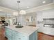 Large kitchen with island, stainless appliances, and hardwood floors at 4643 River Ct, Peachtree Corners, GA 30097