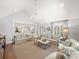 Bright living room with shiplap walls, hardwood floors, and elegant chandelier lighting at 4643 River Ct, Peachtree Corners, GA 30097