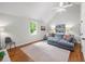 Bright living room with hardwood floors, vaulted ceiling, and a comfortable seating area, perfect for relaxation at 4643 River Ct, Peachtree Corners, GA 30097