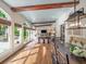 Open-concept living space with a beamed ceiling and view to both the yard and the dining room at 4643 River Ct, Peachtree Corners, GA 30097
